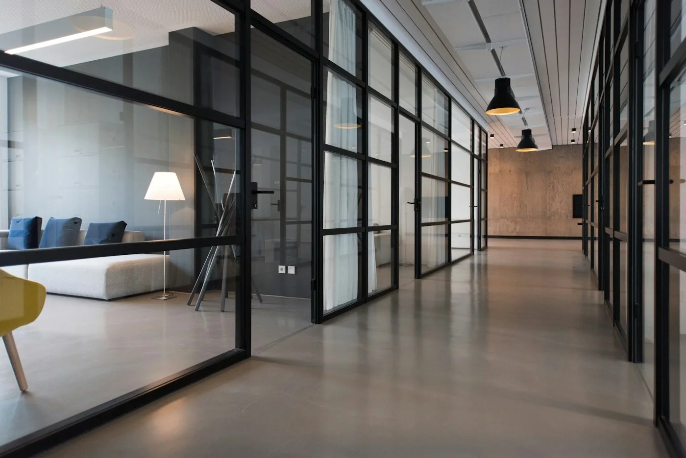 Glass meeting rooms in a contemporary business workspace